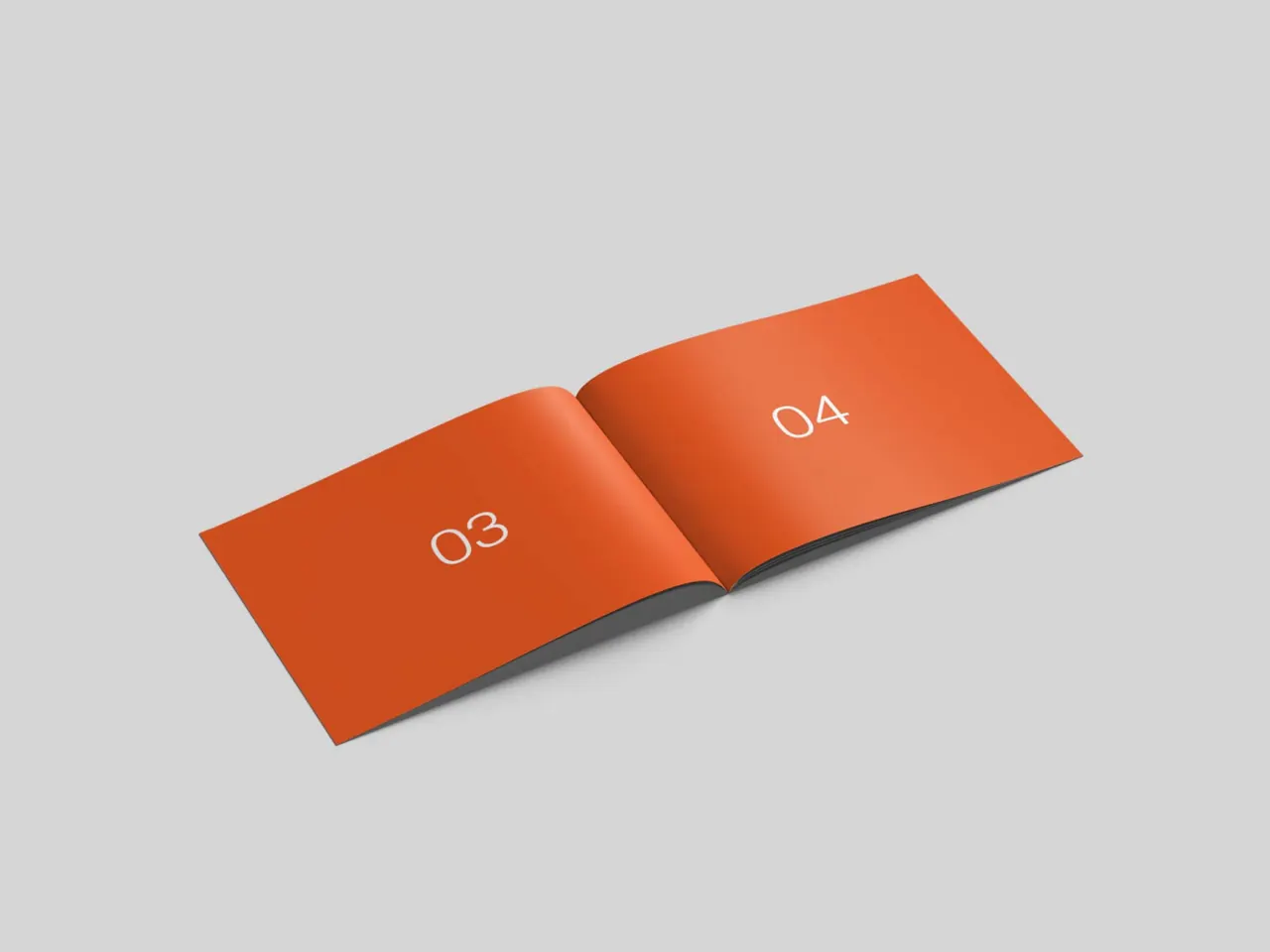 Oransje designhåndbok slått opp